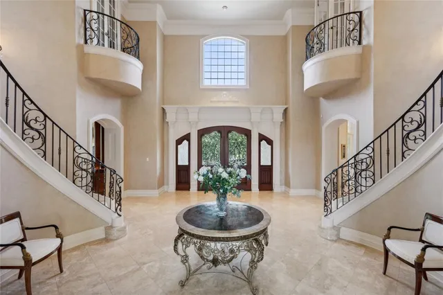 a dining room with furniture and a chandelier