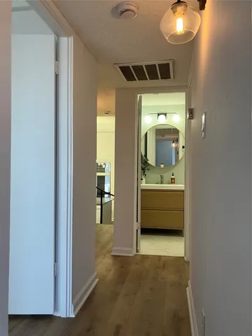 a bathroom with a sink a mirror and a bathtub