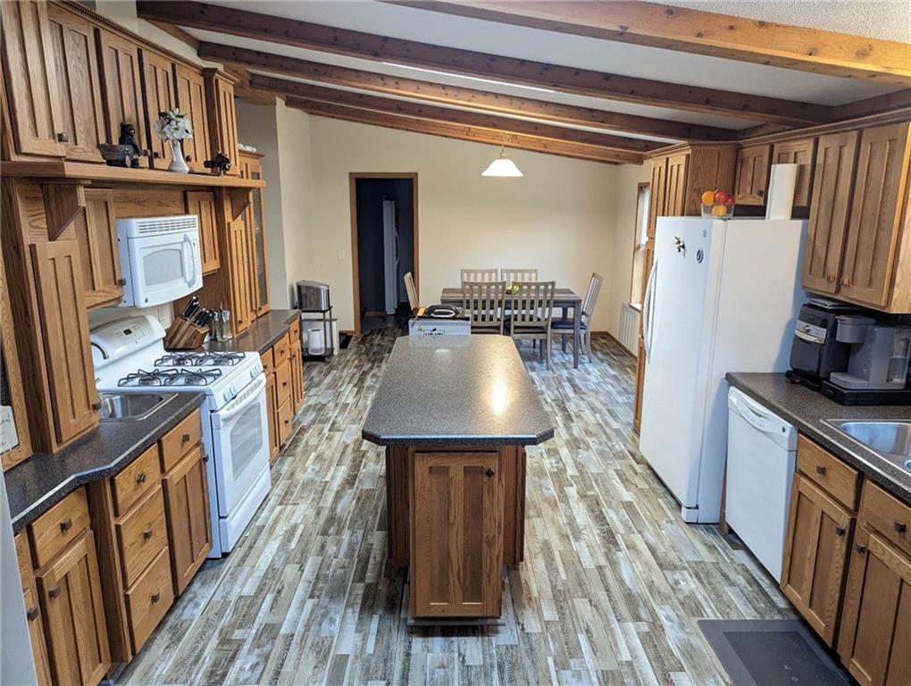 699 Dillie Road Sycamore, PA 15329 - Photo 16 of 21 a kitchen with refrigerator and wooden floor