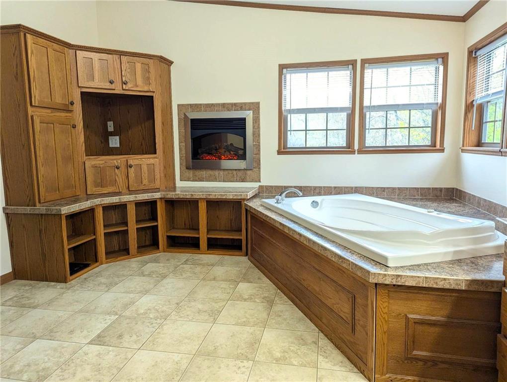 699 Dillie Road Sycamore, PA 15329 - Photo 20 of 21 a view of an empty room with a fireplace and windows