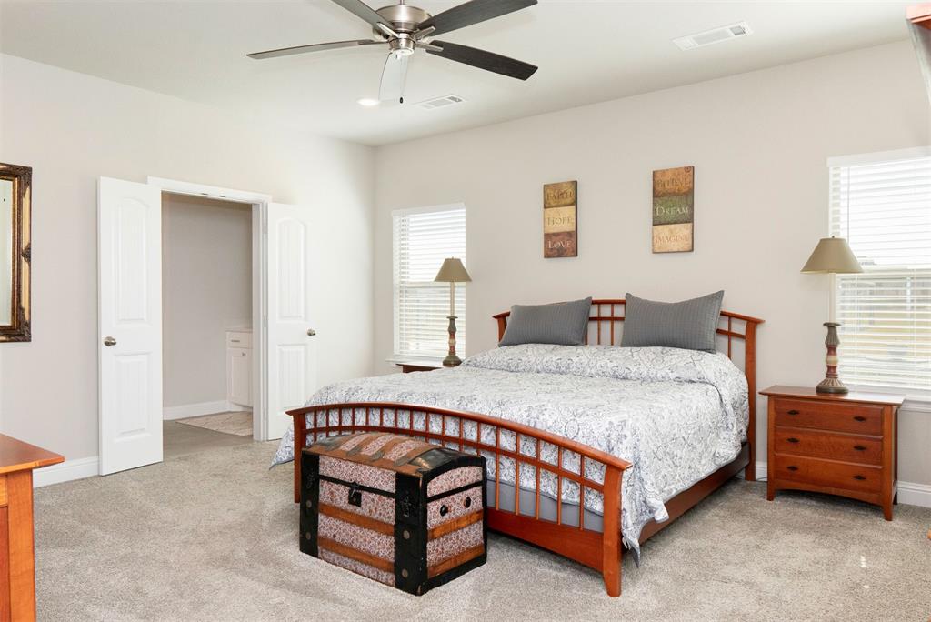 849 County Road 4764 Boyd, TX 76023 - Photo 17 of 40 a bedroom with a bed and a dresser