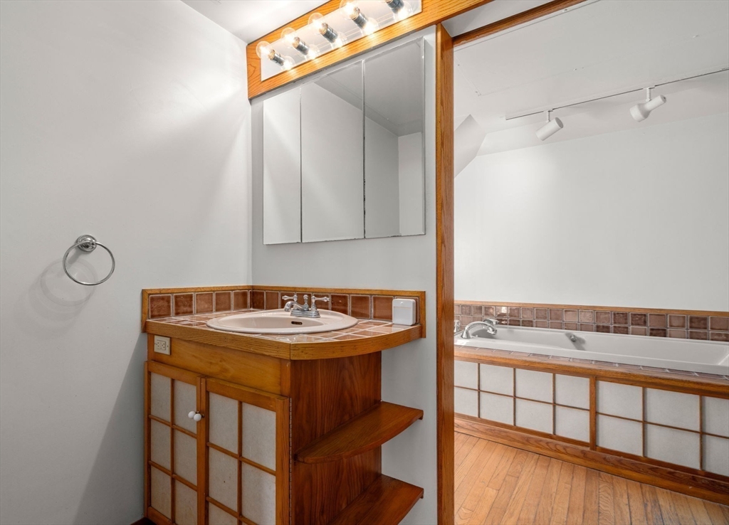 12 Granison Road Weston, MA 02493 - Photo 18 of 32 a bathroom with a sink and a mirror