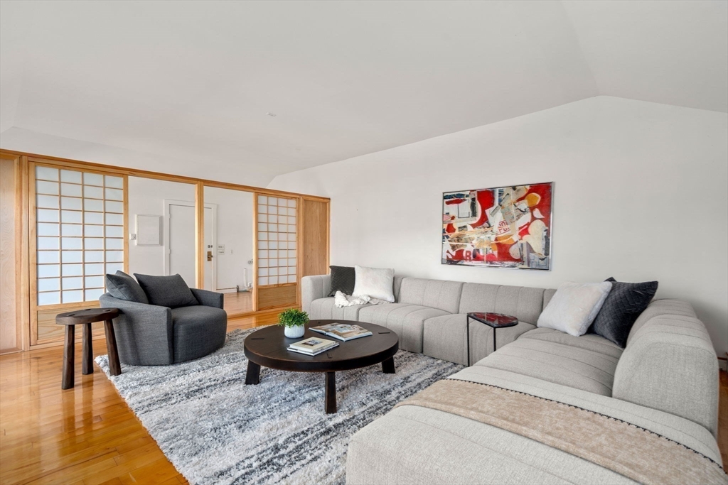 12 Granison Road Weston, MA 02493 - Photo 24 of 32 a living room with furniture a rug and a large window