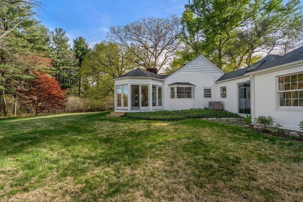 12 Granison Road Weston, MA 02493 - Photo 28 of 32 a front view of a house with a garden
