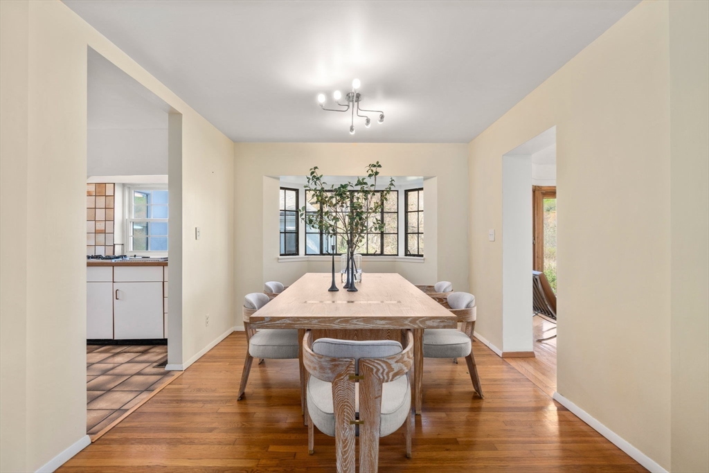 12 Granison Road Weston, MA 02493 - Photo 7 of 32 a view of a dining room with furniture window and wooden floor