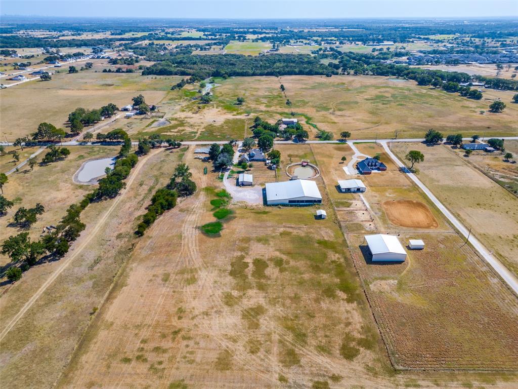 1601 East Blackjack Road East Pilot Point, TX 76258 - Photo 30 of 30 Expansive property featuring multiple outbuildings, fenced areas, a pond, and diverse terrain