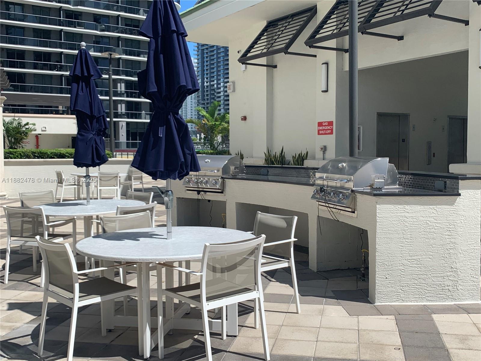 999 Southwest 1st Avenue, Unit 1703 Miami, FL 33130 - Photo 19 of 28 a dining area with a table and chairs