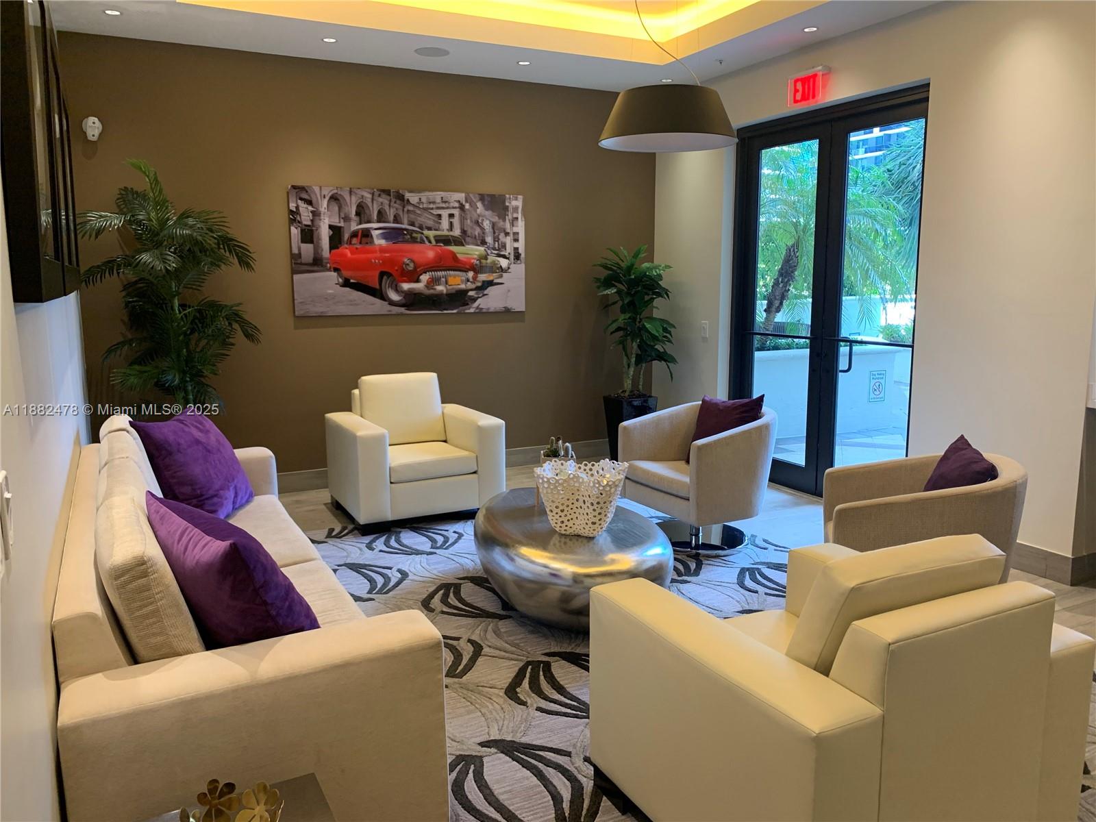 999 Southwest 1st Avenue, Unit 1703 Miami, FL 33130 - Photo 20 of 28 a living room with furniture and a floor to ceiling window