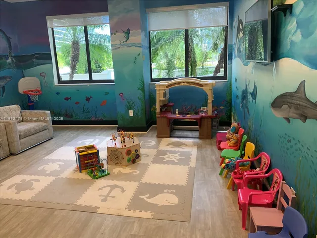 a living room filled with furniture and a window