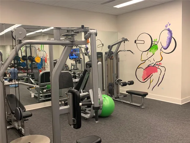 a view of gym equipment with windows