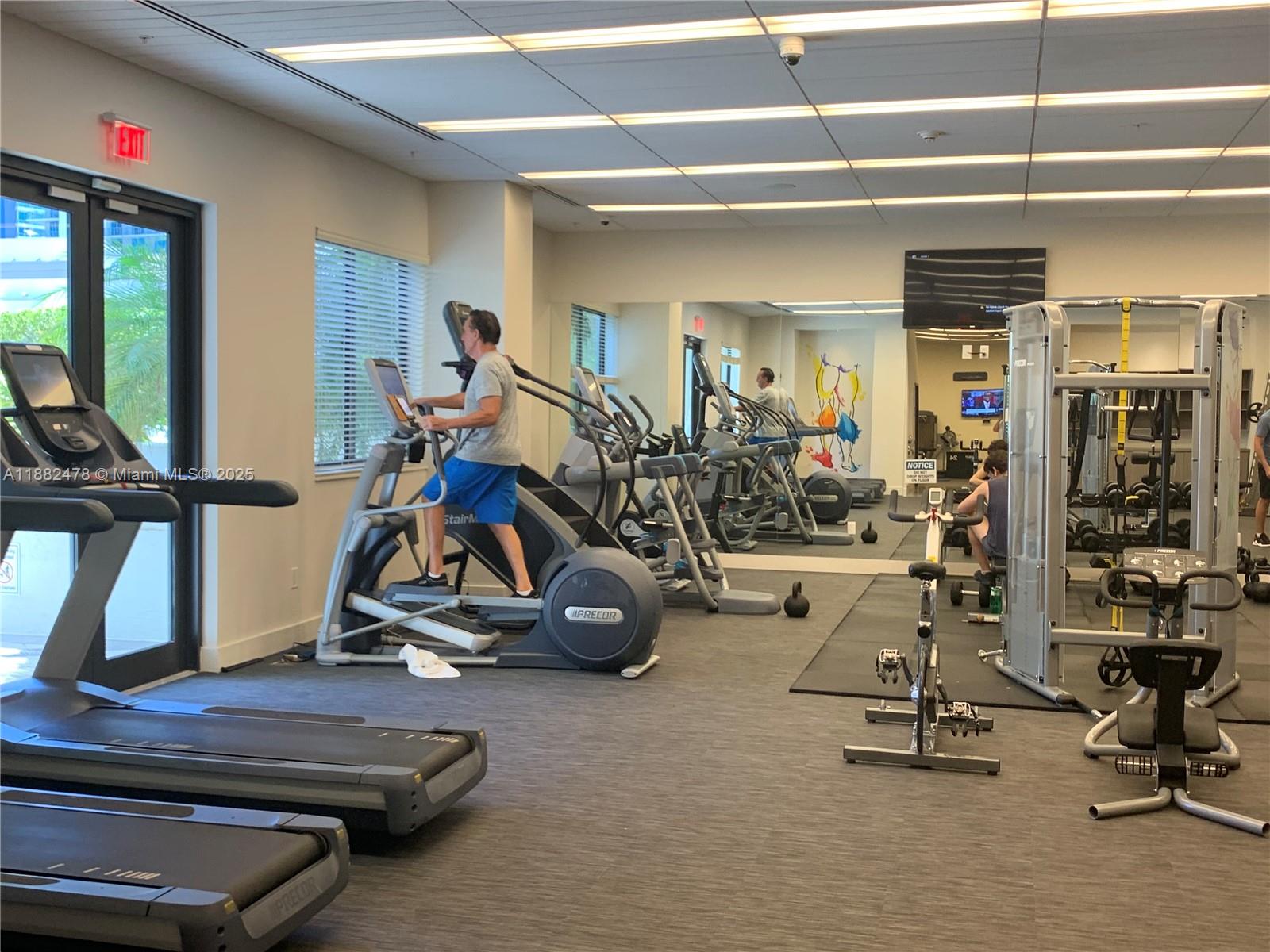 999 Southwest 1st Avenue, Unit 1703 Miami, FL 33130 - Photo 27 of 28 a view of a room with gym equipment