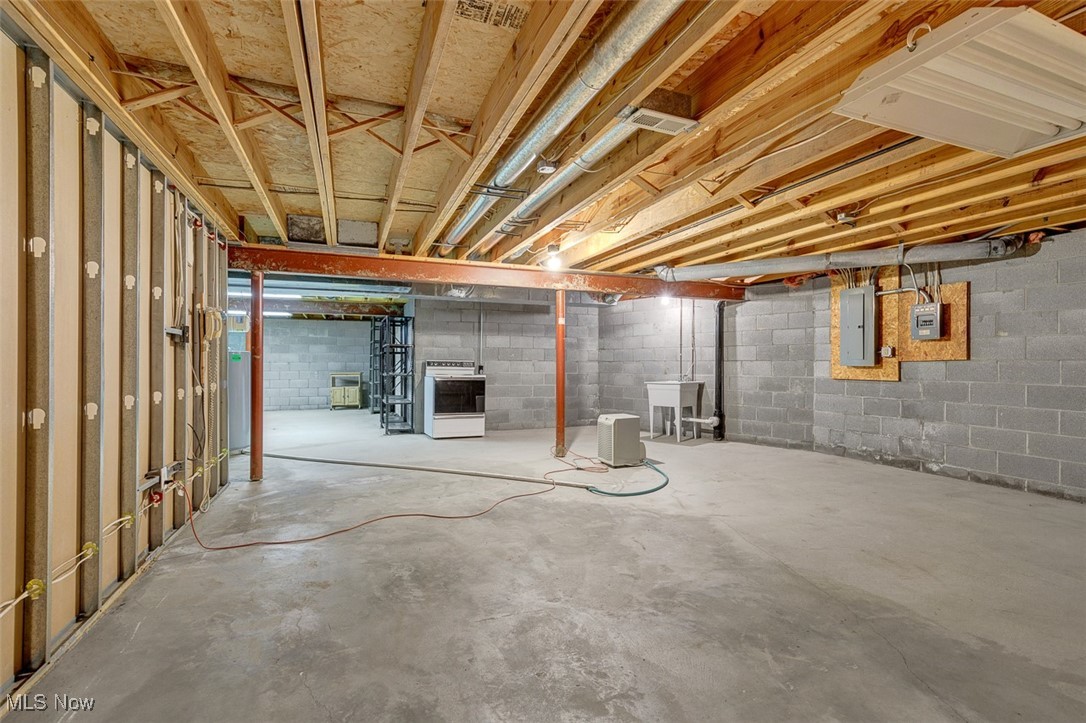 10024 Fair Road Strongsville, OH 44149 - Photo 33 of 41 Unfinished basement with electric panel and heating unit