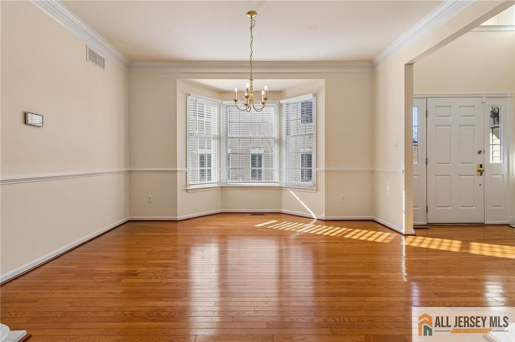 14 Caleb Lane Princeton, NJ 08540 - Photo 12 of 55 a view of an empty room with window and wooden floor