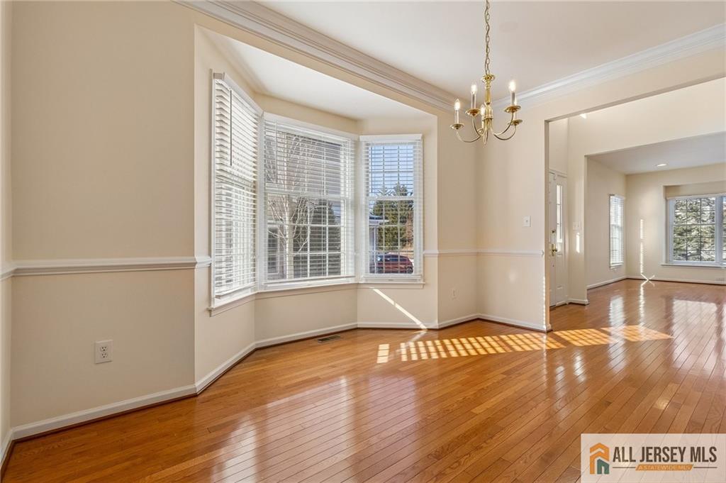14 Caleb Lane Princeton, NJ 08540 - Photo 14 of 55 a view of a livingroom with wooden floor and a ceiling fan
