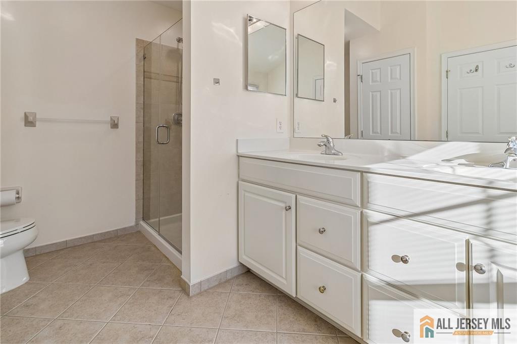 14 Caleb Lane Princeton, NJ 08540 - Photo 30 of 55 a bathroom with a sink a toilet and shower