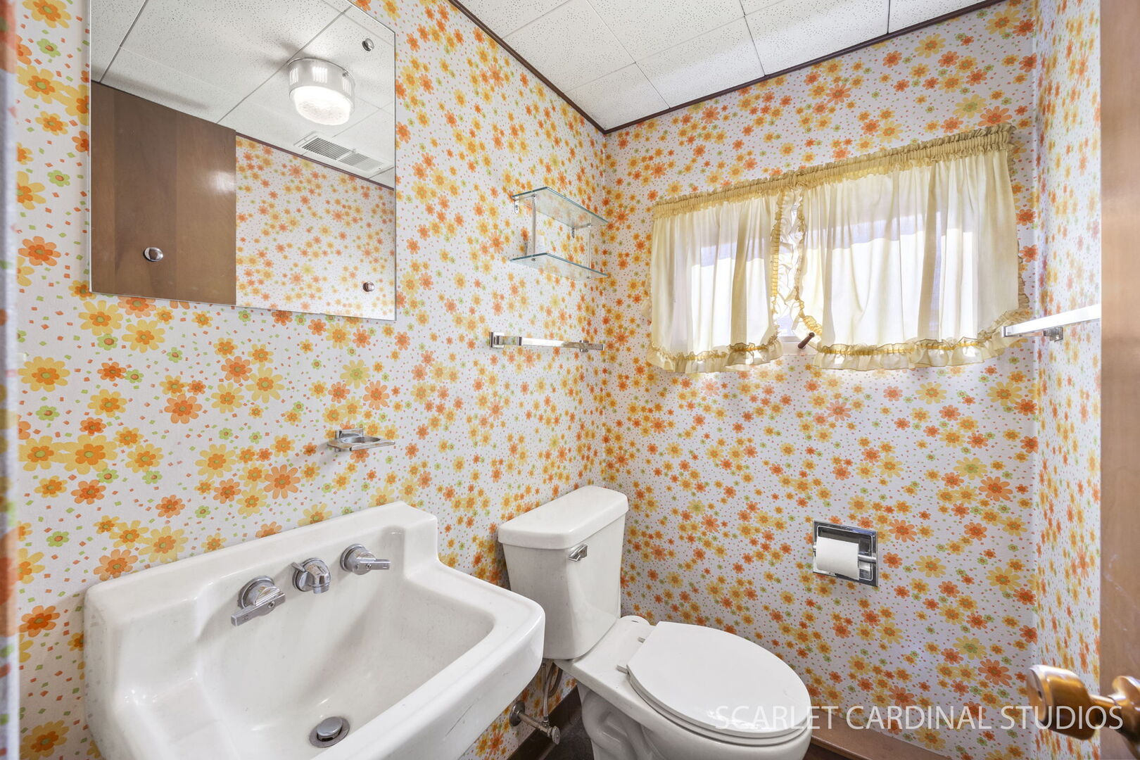 1210 Lawnmeadow Lane Naperville, IL 60540 - Photo 13 of 37 a white toilet sitting next to a white sink and a shower curtain