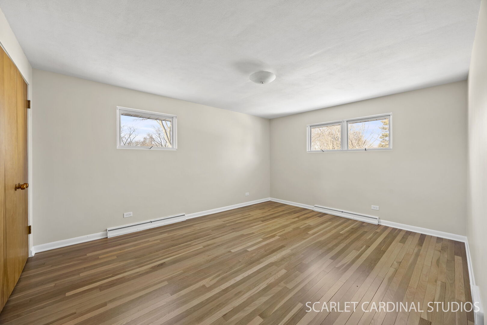 1210 Lawnmeadow Lane Naperville, IL 60540 - Photo 20 of 37 a view of empty room with wooden floor and fan