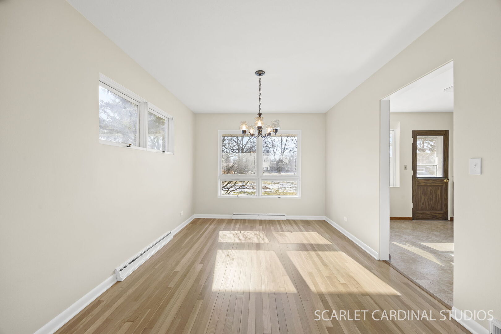 1210 Lawnmeadow Lane Naperville, IL 60540 - Photo 6 of 37 wooden floor in an empty room with a window