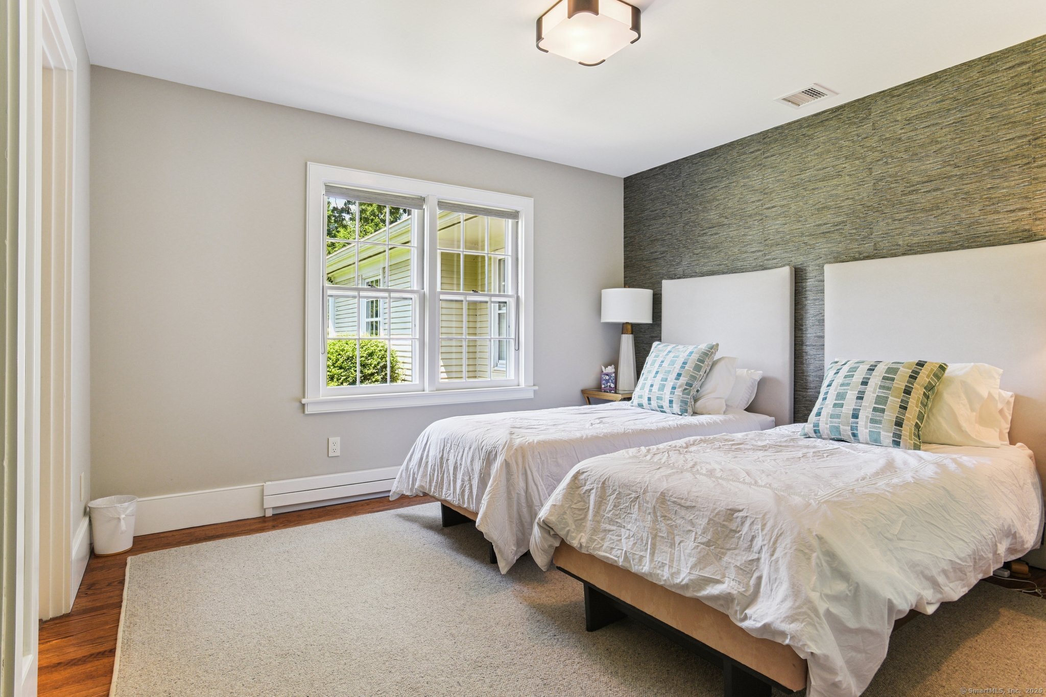 455 Stonington Road Stonington, CT 06378 - Photo 20 of 39 a bedroom with a bed and window