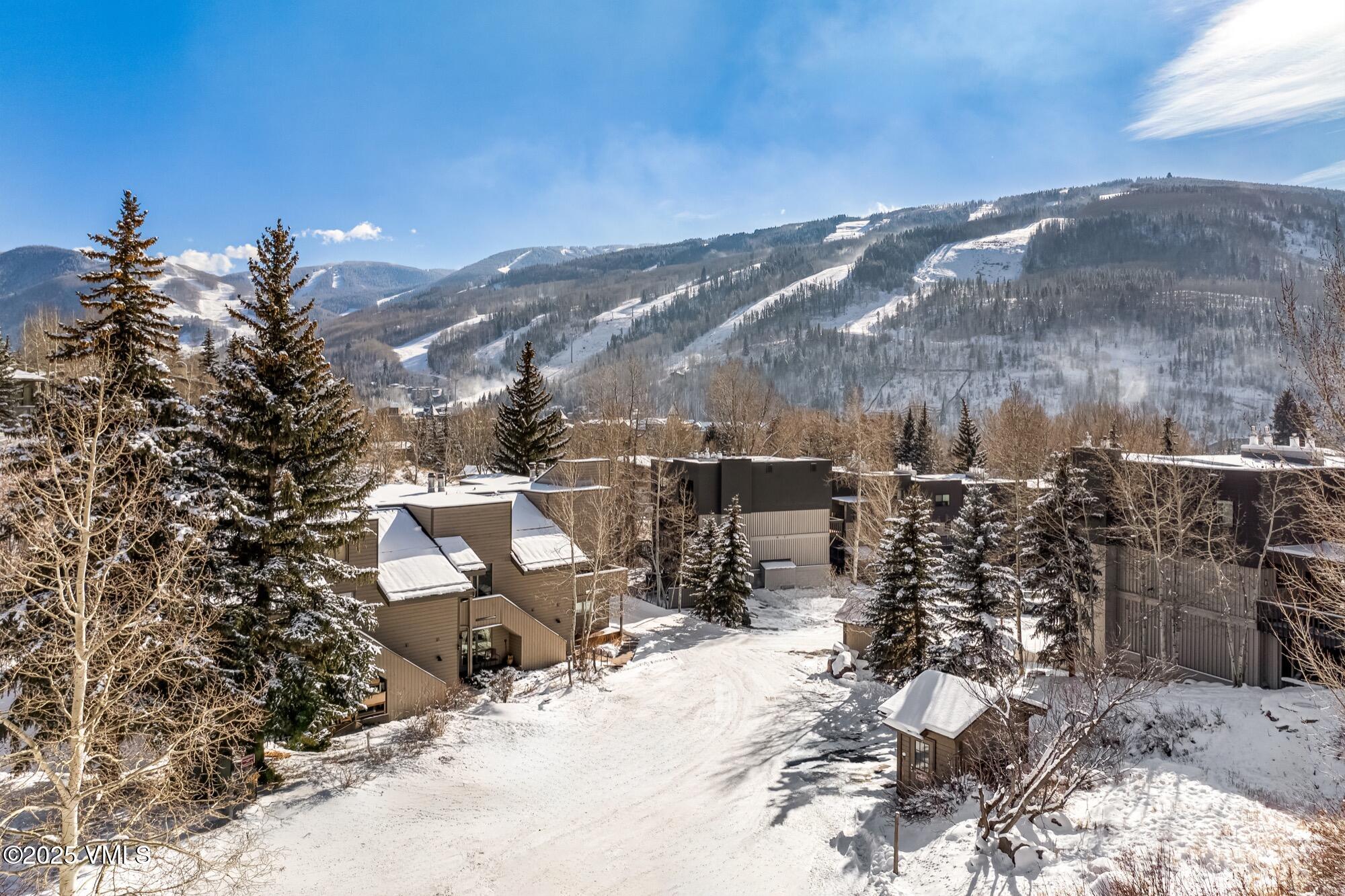 945 Red Sandstone Road, Unit A5 Vail, CO 81657 - Photo 37 of 38 a view of a terrace with sitting area
