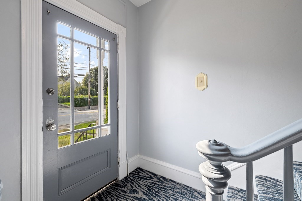 253 Mammoth Road Lowell, MA 01854 - Photo 12 of 42 a room with glass door