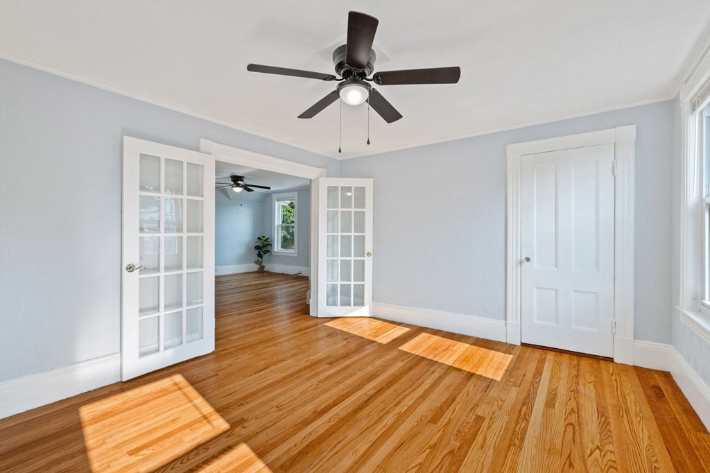 253 Mammoth Road Lowell, MA 01854 - Photo 17 of 42 a view of empty room with wooden floor