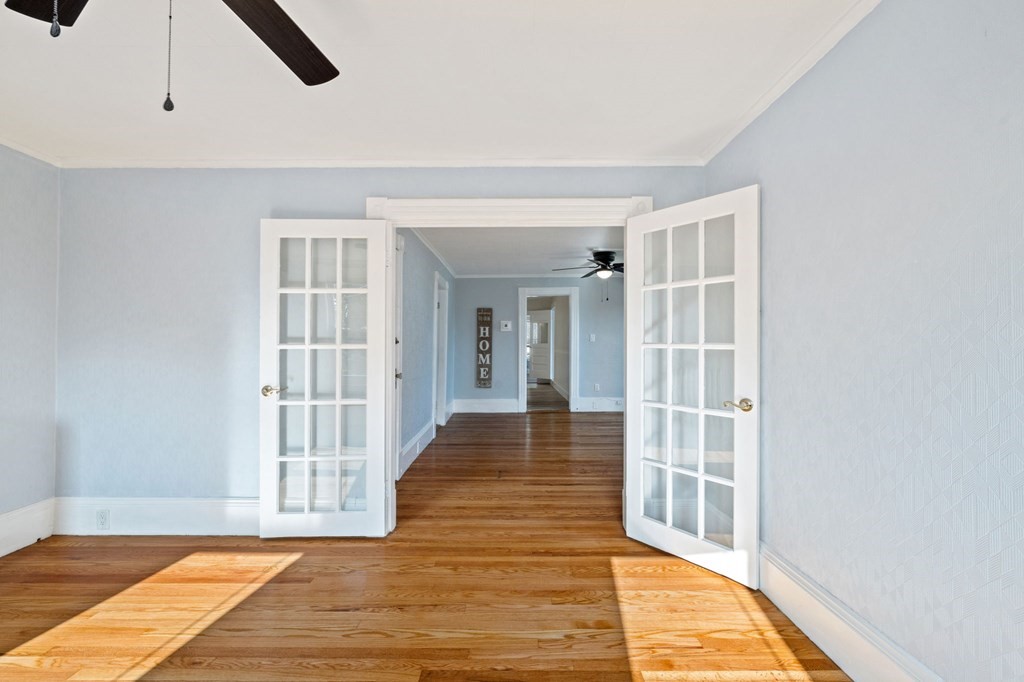253 Mammoth Road Lowell, MA 01854 - Photo 18 of 42 a view of a livingroom with wooden floor and furniture