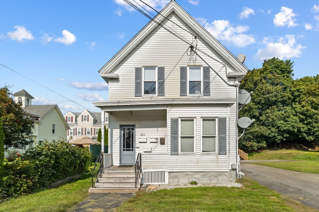 253 Mammoth Road Lowell, MA 01854 - Photo 2 of 42 a view of house that has a window and garden