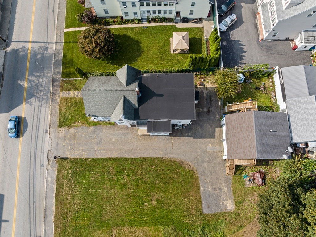 253 Mammoth Road Lowell, MA 01854 - Photo 7 of 42 an aerial view of a house with a swimming pool