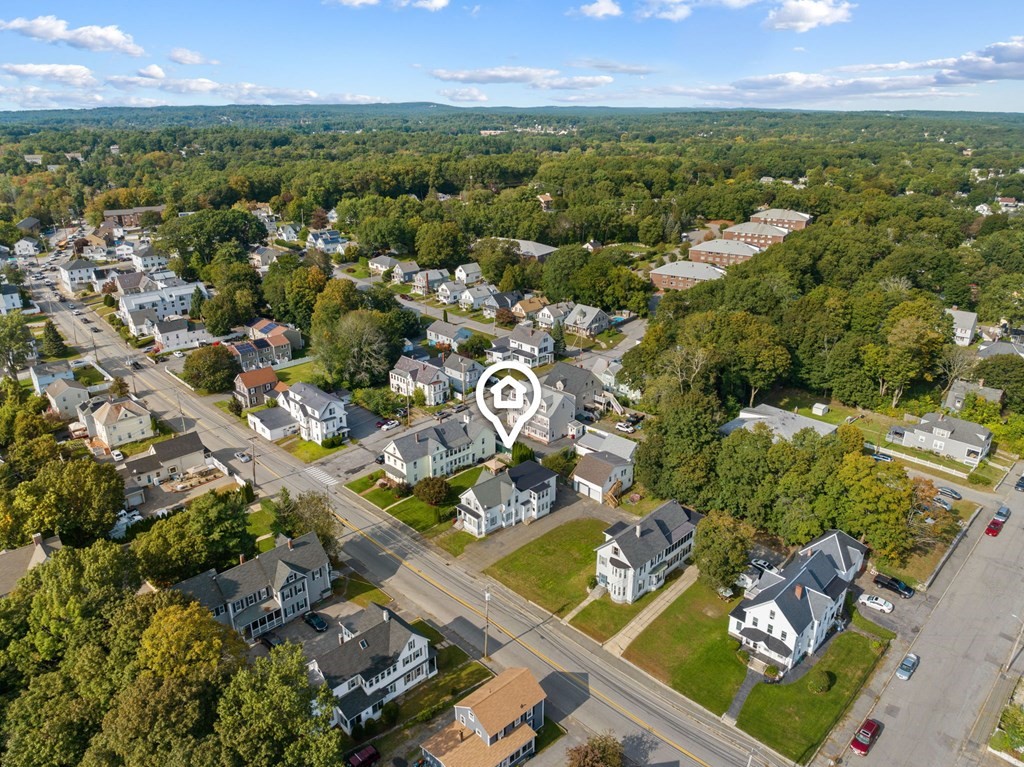 253 Mammoth Road Lowell, MA 01854 - Photo 8 of 42 an aerial view of residential building with outdoor space