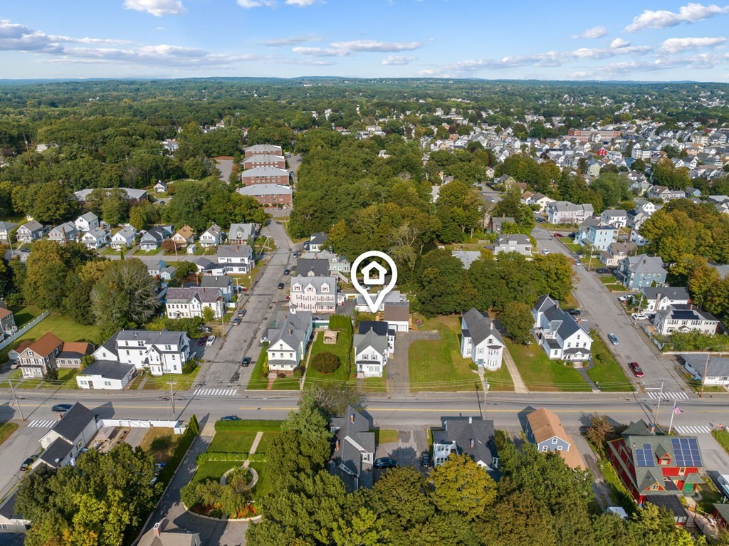 253 Mammoth Road Lowell, MA 01854 - Photo 9 of 42 an aerial view of residential houses with outdoor space and swimming pool