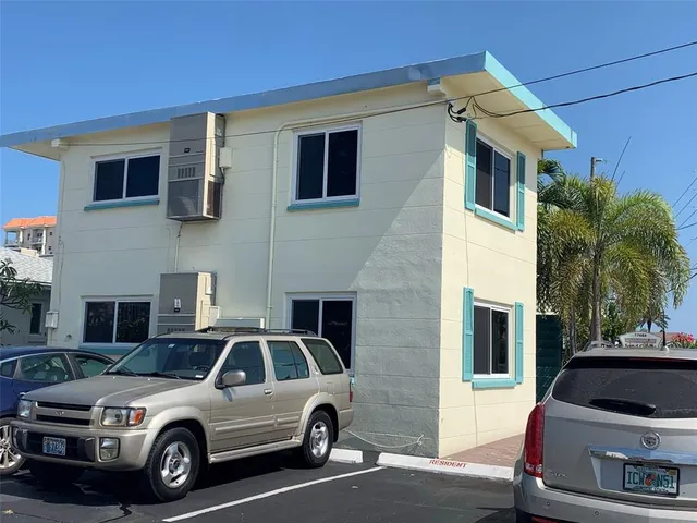 a view of a car parked in front of a house