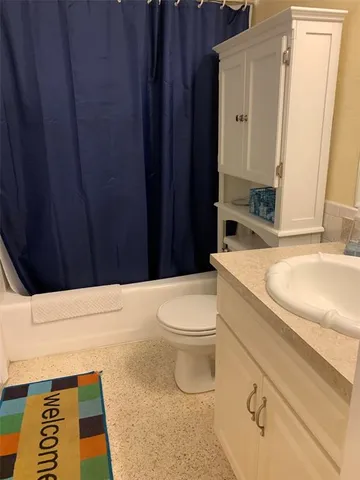 a bathroom with a toilet and a sink