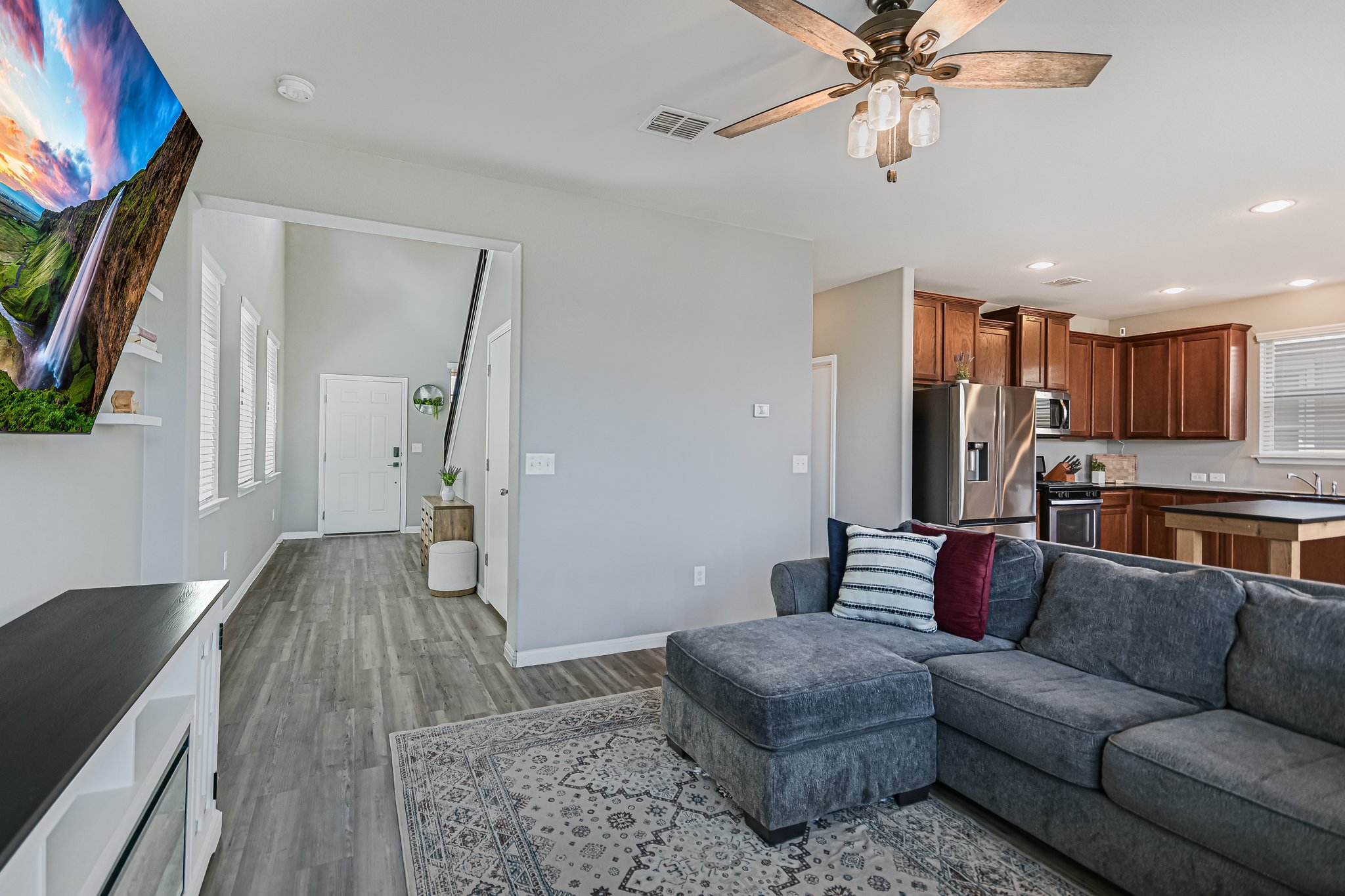 225 Vestral Road Buda, TX 78610 - Photo 7 of 17 From the front door to the kitchen, the open main level keeps everyday living connected while still giving each space a sense of its own.