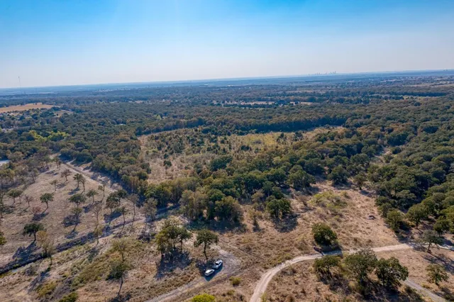 an aerial view of residential house and green space