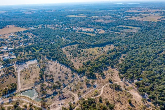 an aerial view of mountain with beach