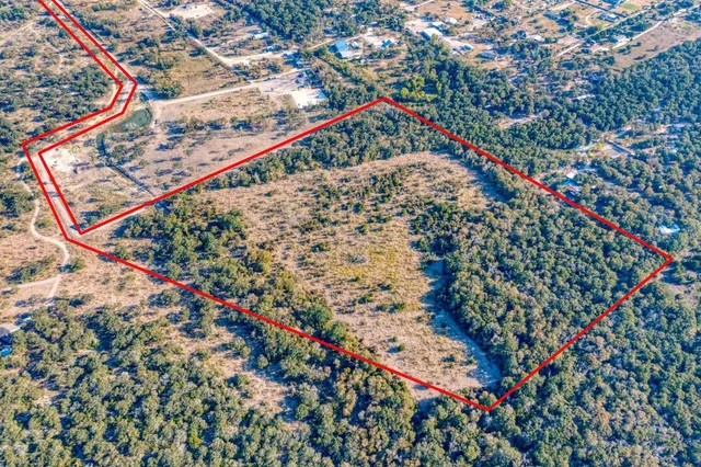 a view of a field with an ocean