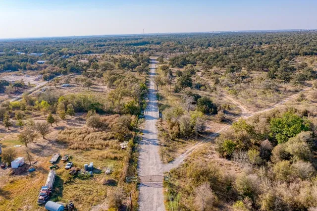 an aerial view of residential house with parking space