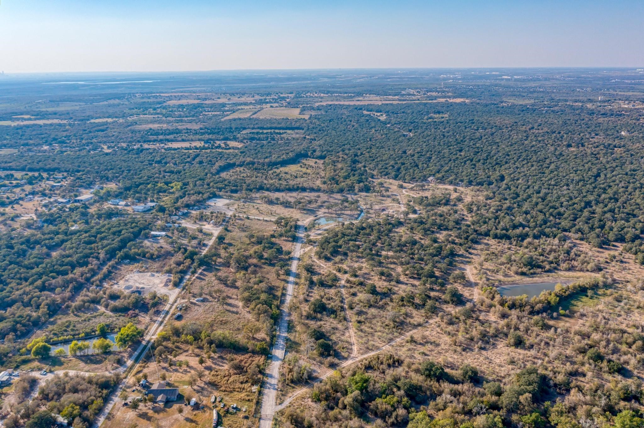 9202 Lockwood Springs Road Manor, TX 78653 - Photo 21 of 27 an aerial view of forest