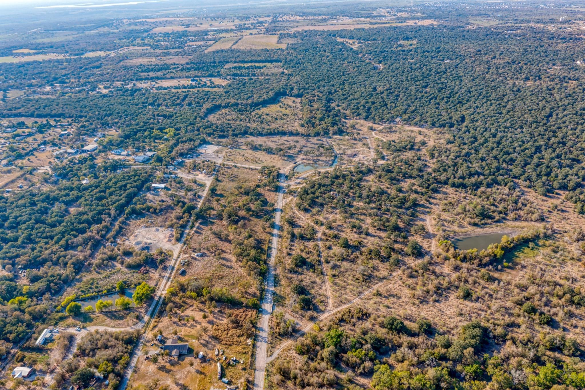 9202 Lockwood Springs Road Manor, TX 78653 - Photo 22 of 27 an aerial view of forest