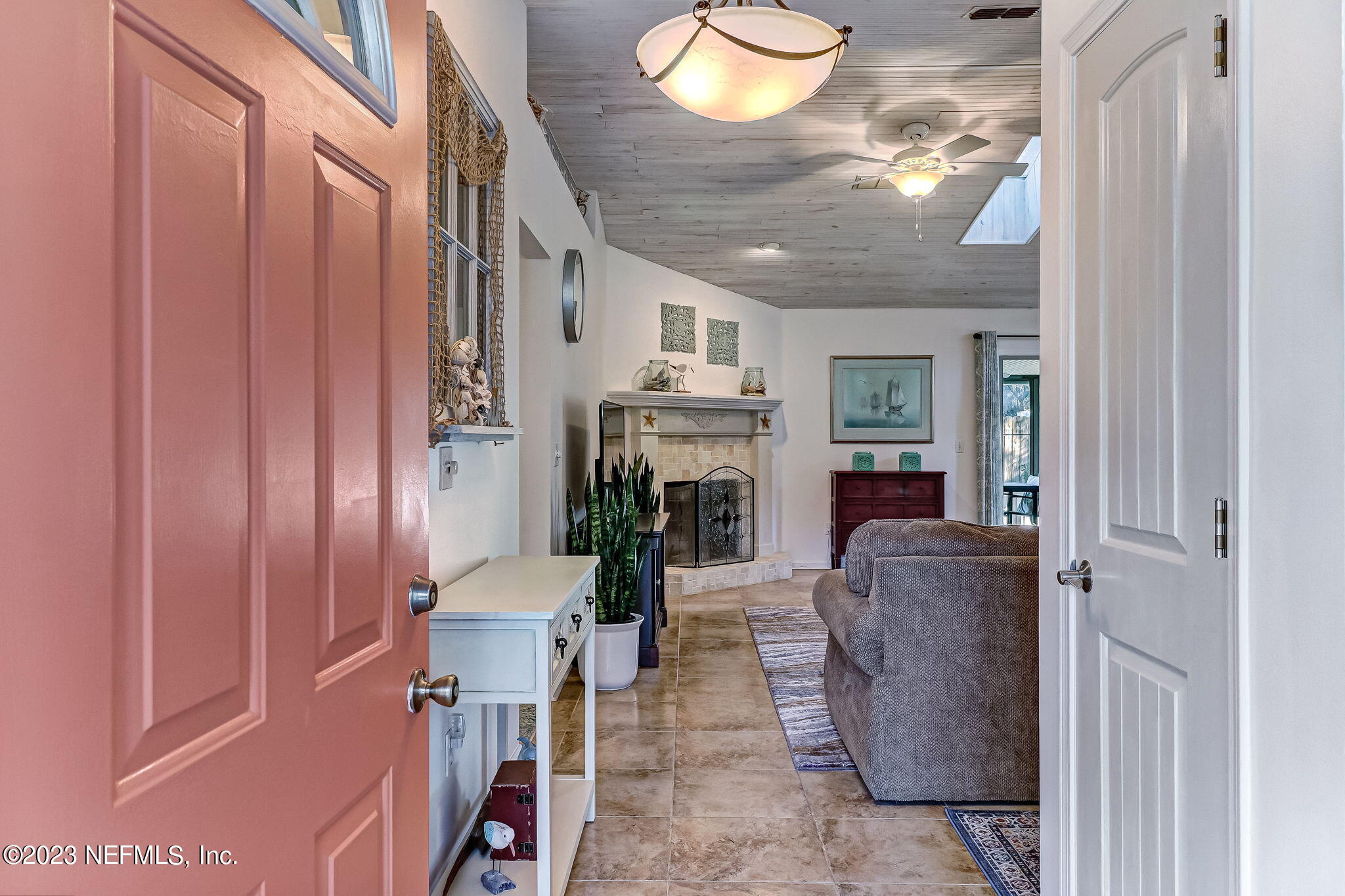 2212 Will Hardee Road Fernandina Beach, FL 32034 - Photo 5 of 24 a living room with furniture and a chandelier
