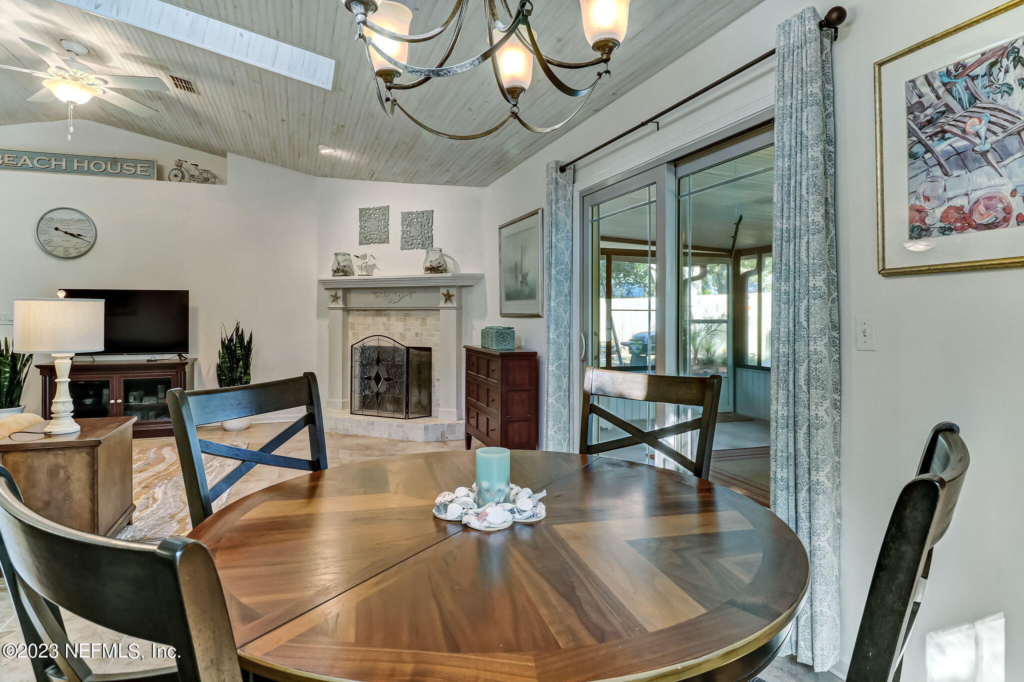2212 Will Hardee Road Fernandina Beach, FL 32034 - Photo 7 of 24 a living room with fireplace furniture and a flat screen tv