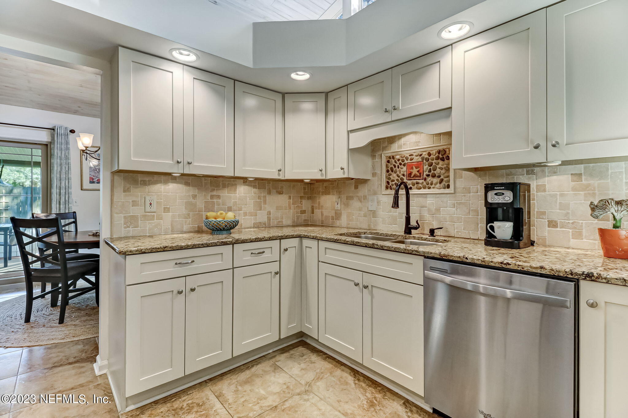 2212 Will Hardee Road Fernandina Beach, FL 32034 - Photo 9 of 24 a kitchen with granite countertop white cabinets white appliances and sink