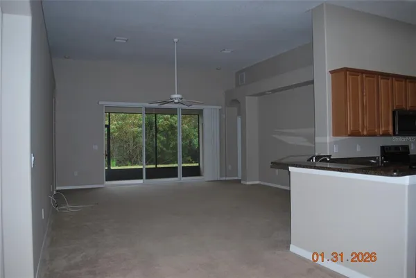 a kitchen with stainless steel appliances granite countertop a sink a stove and a refrigerator