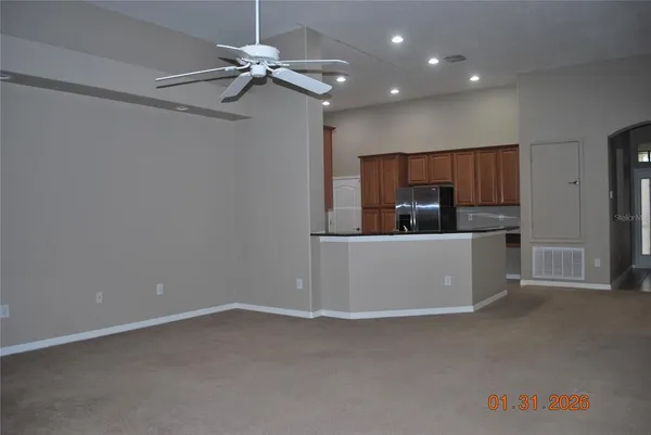 a view of a kitchen with a sink and cabinet