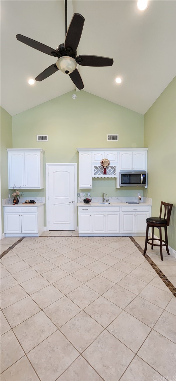 230 San Antonio Road Arcadia, CA 91007 - Photo 5 of 25 a view of a room with gym equipment and a chandelier