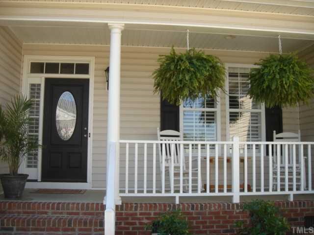 1016 Shellfish Drive Willow Spring, NC 27592 - Photo 10 of 12 a view of a house with a porch