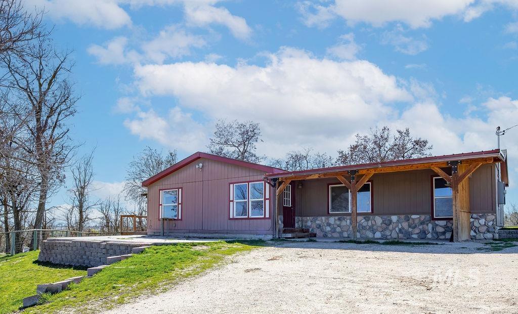 7370 Sagebrush Lane Caldwell, ID 83607 - Photo 5 of 40 View of front of home featuring a patio area and stone siding