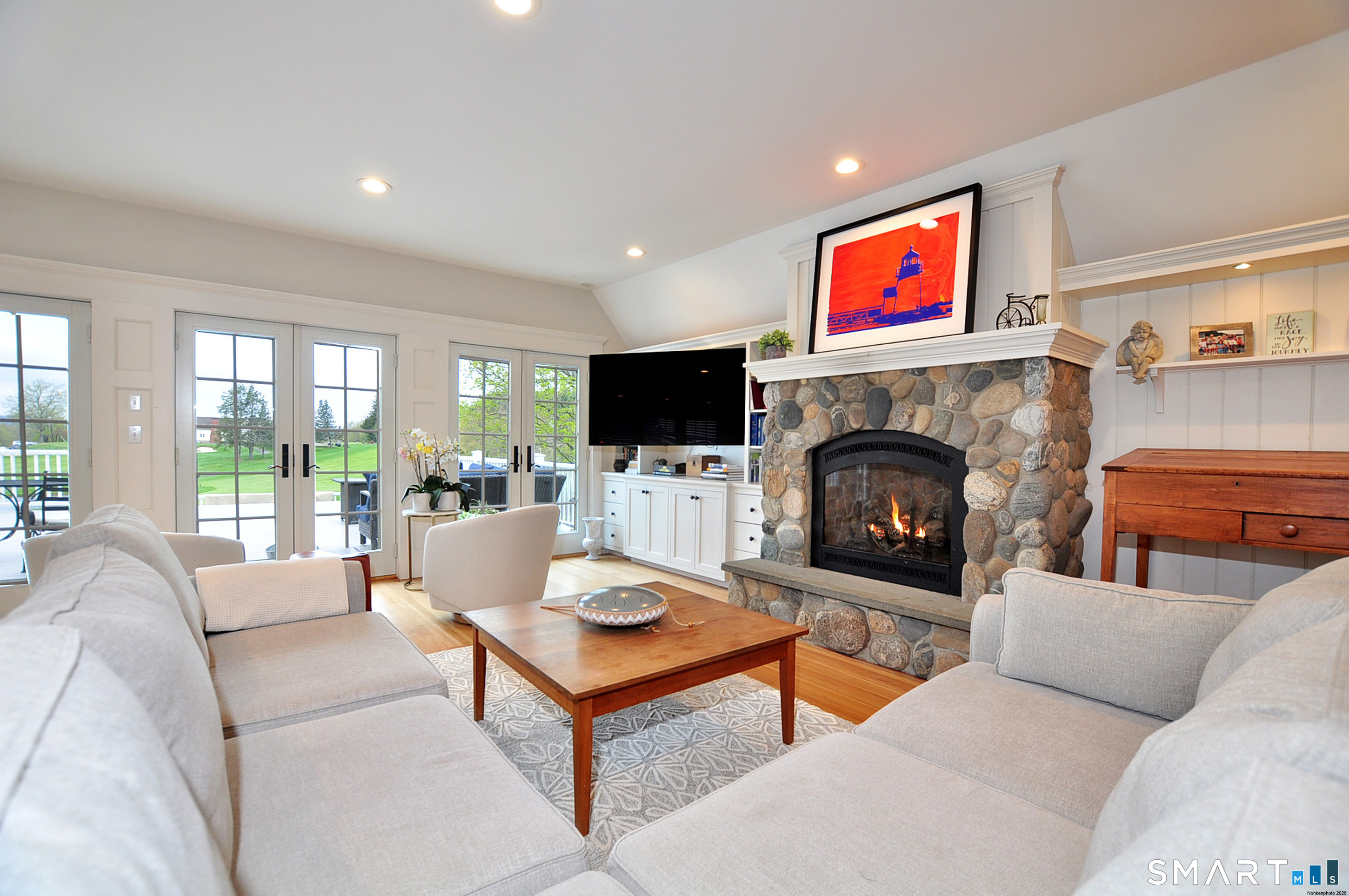 371 North Main Street Suffield, CT 06078 - Photo 6 of 39 a living room with fireplace furniture and a flat screen tv
