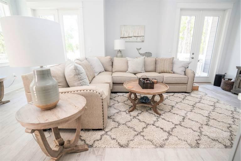 249 Milestone Dr Inlet Beach, Unit A Inlet Beach, FL 32461 - Photo 2 of 18 a living room with furniture and a table